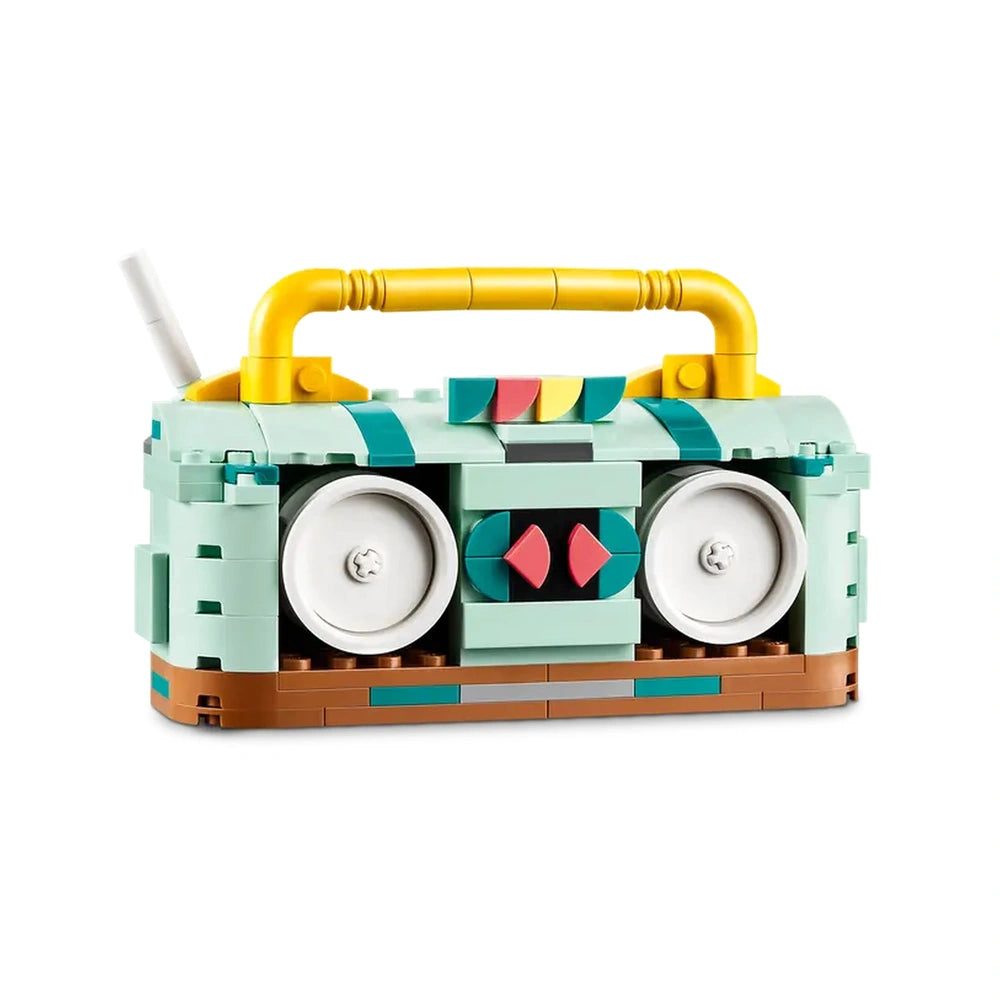 LEGO Creator Retro Roller Skate set features a vibrant, retro-style boombox in teal and brown, with colorful buttons and a shiny yellow handle.