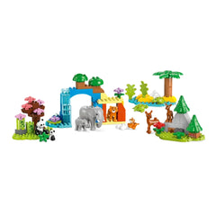 Colorful LEGO® DUPLO® 3in1 Wild Animal Families construction set featuring an elephant with its calf, a playful lion, and various animal figures among vibrant trees and flowers, set against a serene habitat backdrop.