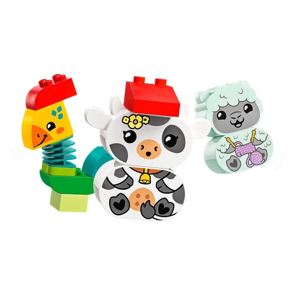Colorful LEGO® DUPLO® animal figures including a cheerful cow, a playful rooster, and a cute lamb, all designed for toddlers.