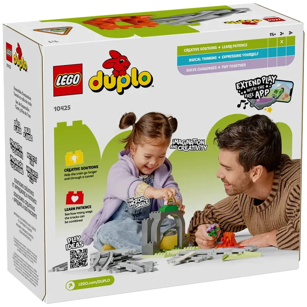 A young girl and an adult man play together with LEGO® DUPLO® Train Tunnel and Tracks Expansion Set, smiling as they build and explore.