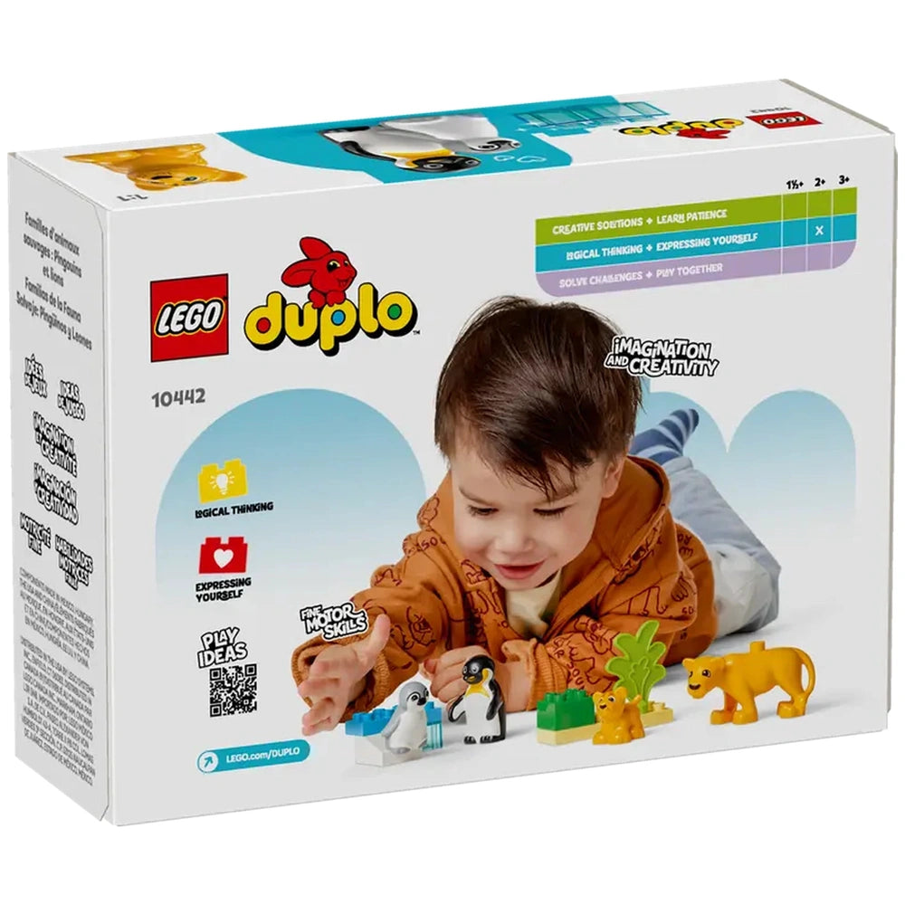 A young boy in a playful orange hoodie interacts with LEGO® DUPLO® figures, including penguins and lions, on a colorful play mat.