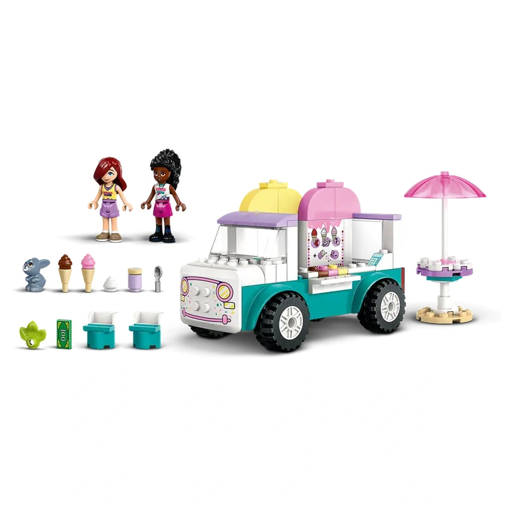 Two LEGO® Friends minidolls stand beside a vibrant ice cream truck, featuring colorful cones, a bunny figure, and play accessories.