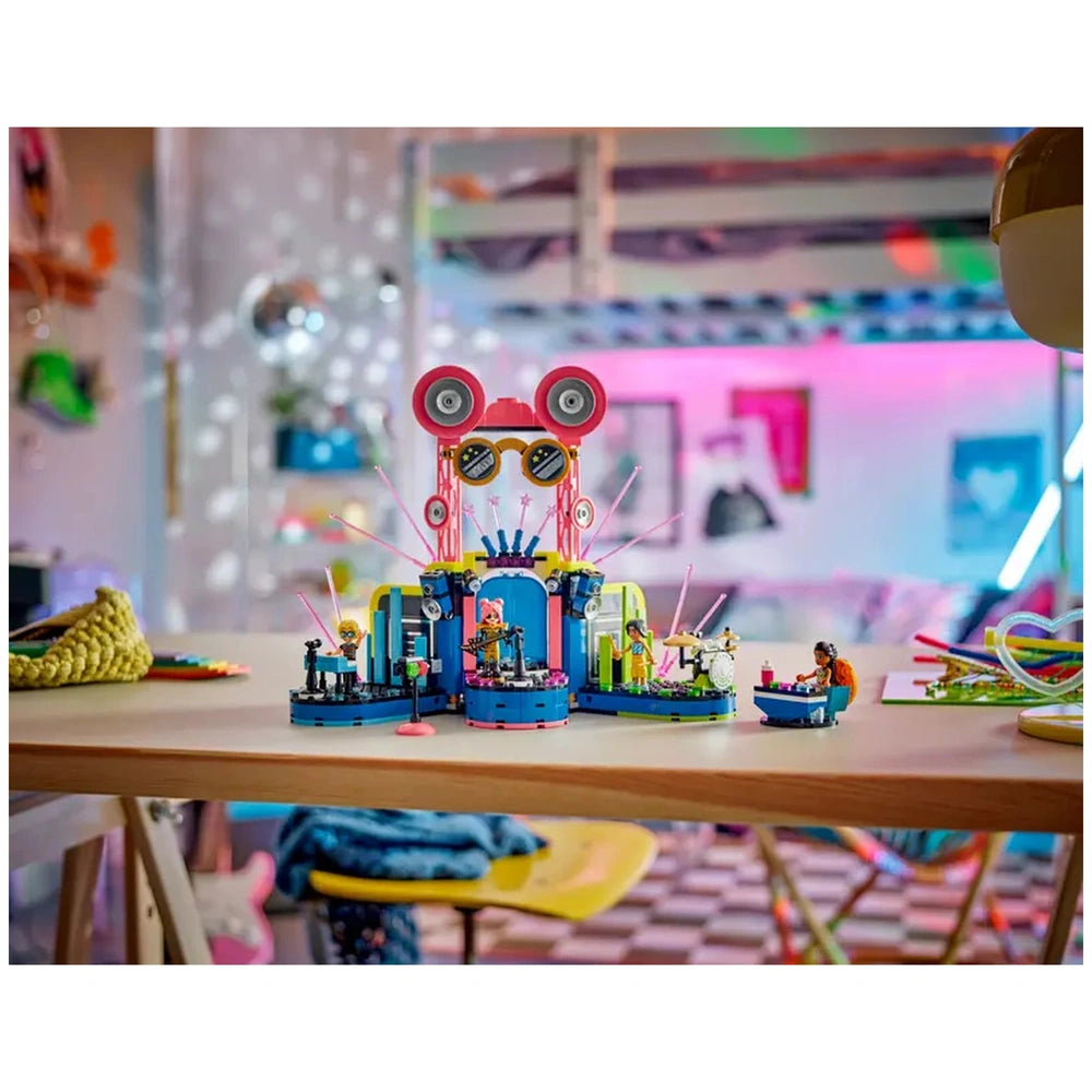 Colorful LEGO Friends Heartlake City Music Talent Show set featuring a vibrant music stage with mini-dolls performing, surrounded by playful decor.