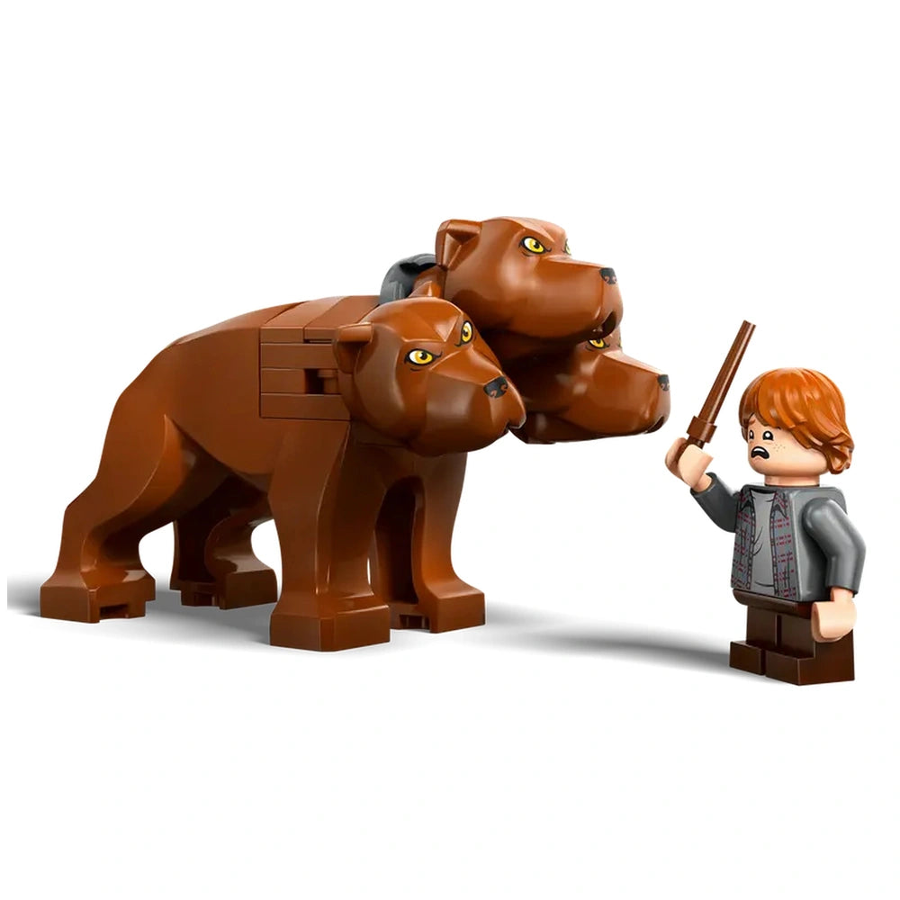 Brown three-headed LEGO dog model standing next to a worried minifigure holding a wand, showcasing elements from Harry Potter.
