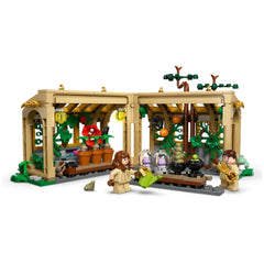 LEGO Hogwarts™ Herbology Class set with a detailed greenhouse, featuring two minifigures, potted plants, and magical elements.