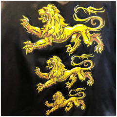 Liontouch King Cape featuring a smooth dark fabric with a central gold design and four lion motifs.