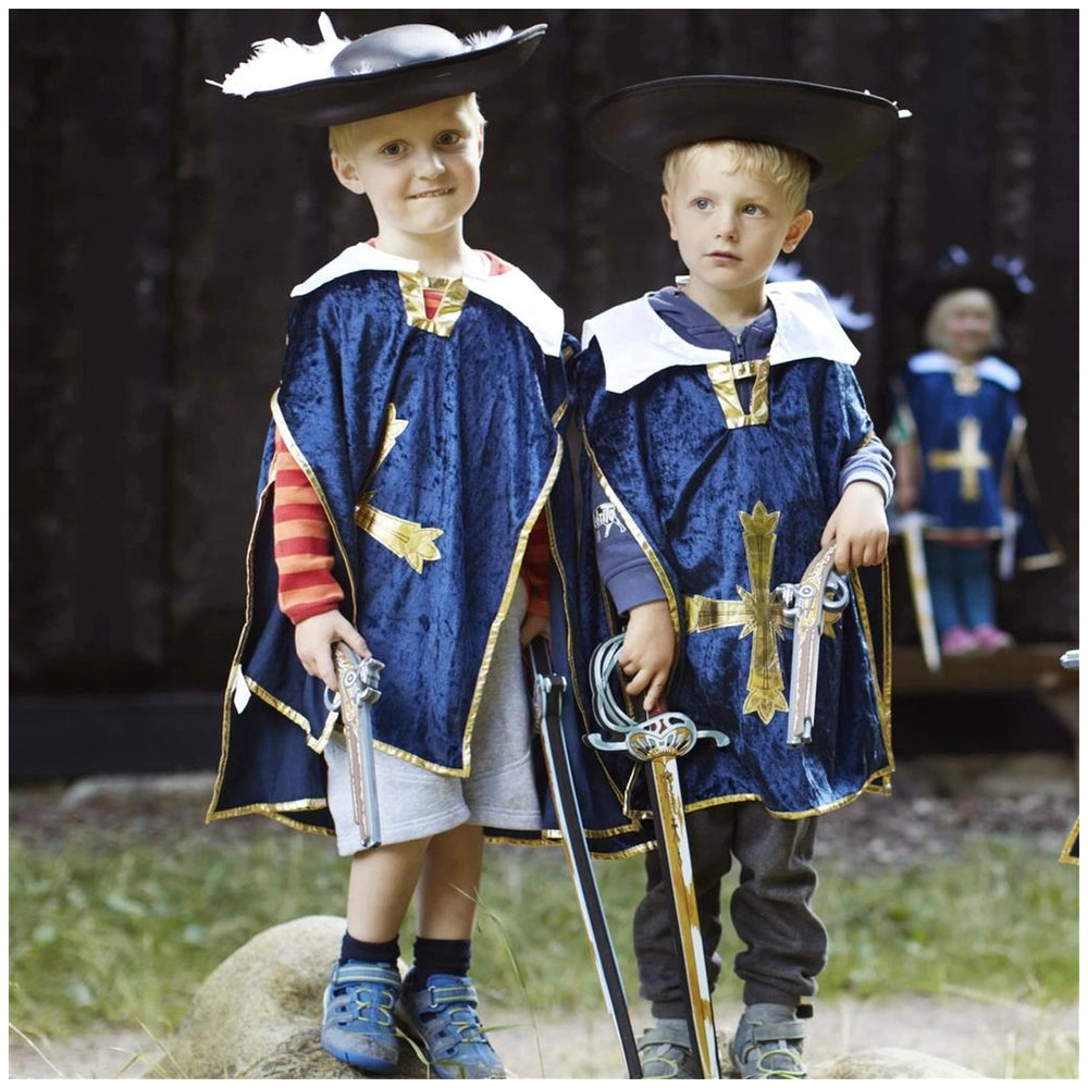 Liontouch Musketeer Sword held by two boys in blue costumes with shiny fabric, black hats, and outdoor greenery backdrop.