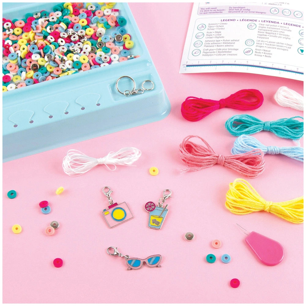 MAKE IT REAL Summer Vibes Heishi Bead Set featuring colorful yarns and a blue container with a white ribbon.