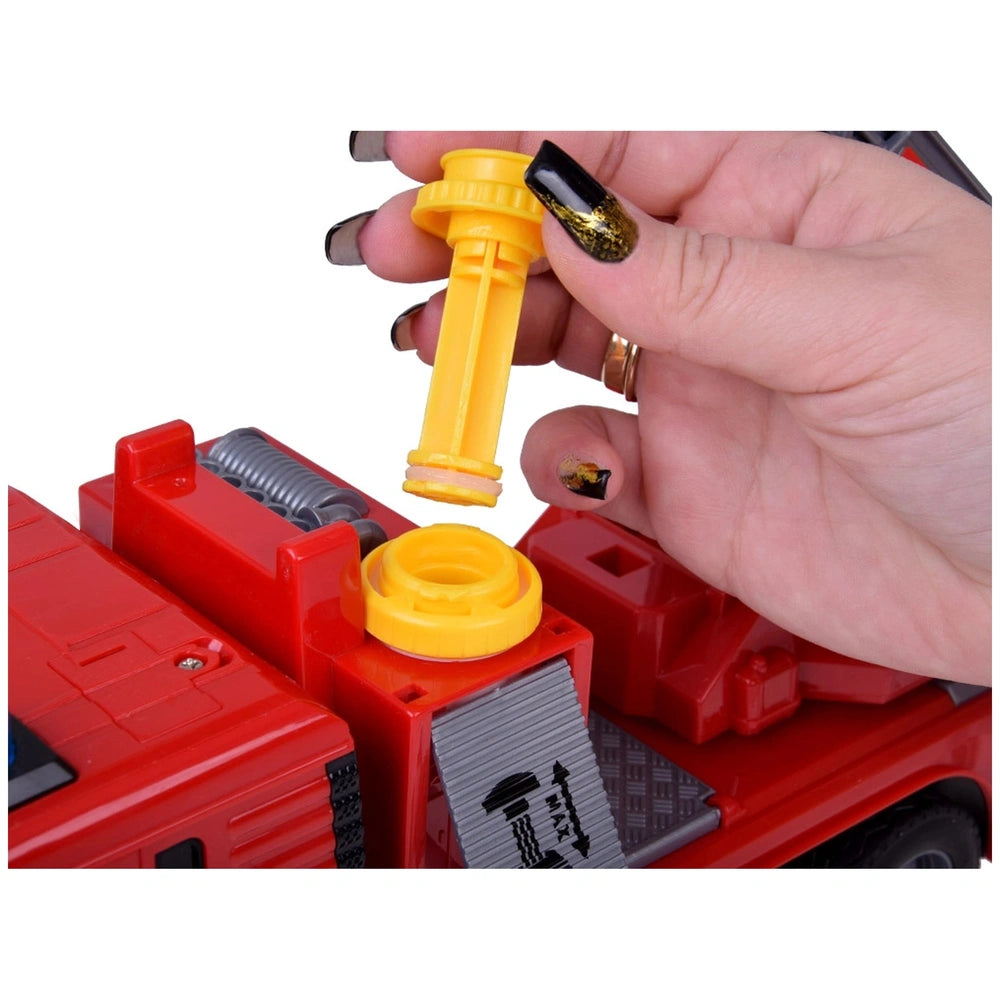 Yellow plastic piece with a hole held in a hand with black nail polish, positioned over a red object on a white background.