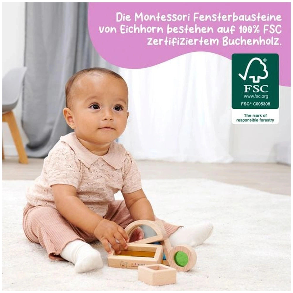 Montessori Window Building Blocks Set: young child plays with wooden blocks on a carpeted floor in a cozy indoor setting.