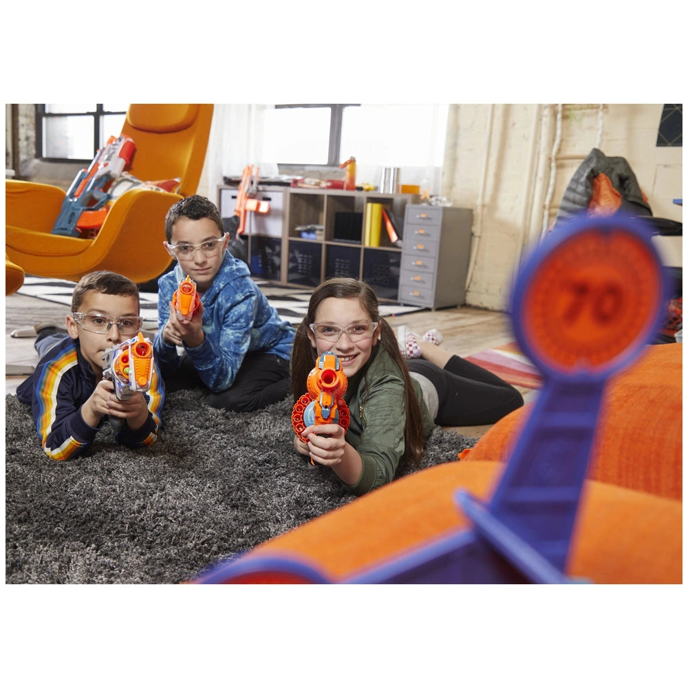 Nerf Elite 2.0 Shockwave RD-15 blaster with three children playing on a gray carpet beside an orange chair.