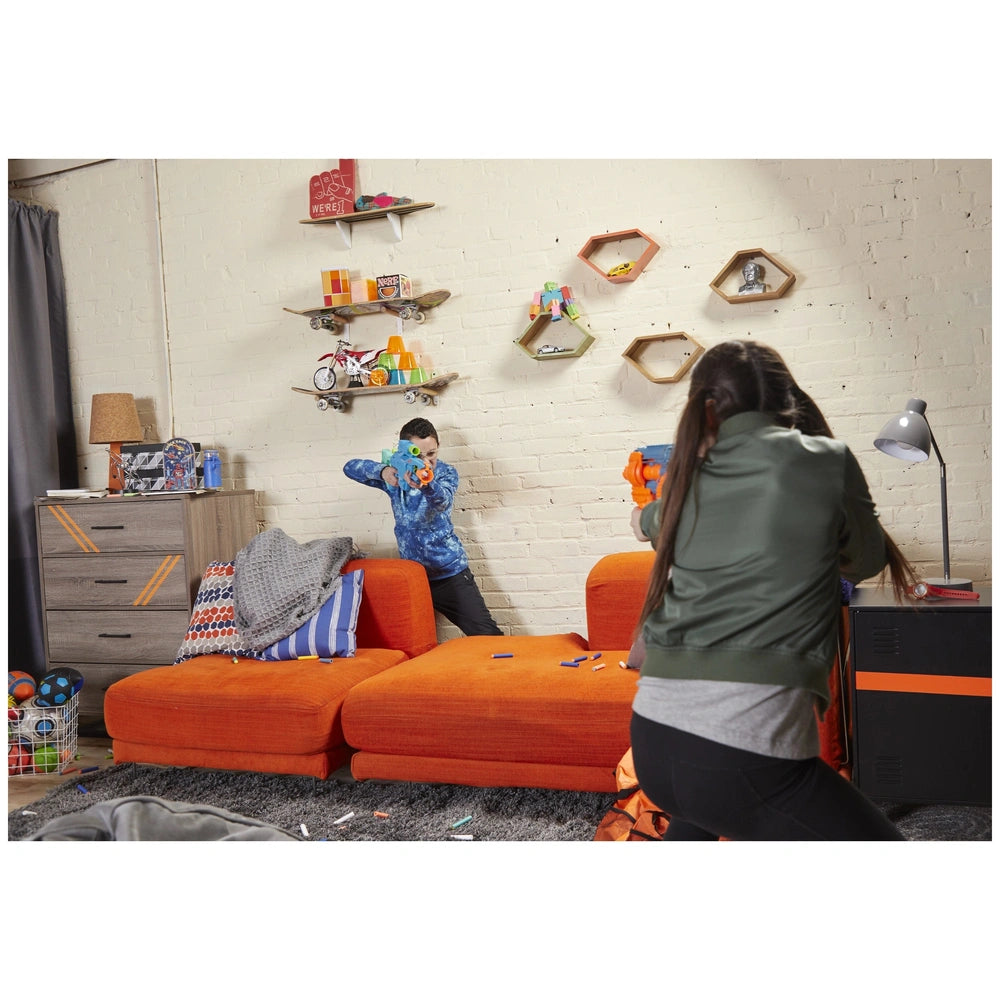 Nerf Elite 2.0 Shockwave RD-15 Blaster displayed on a wooden shelf with two people playing in a stylish living room setting.