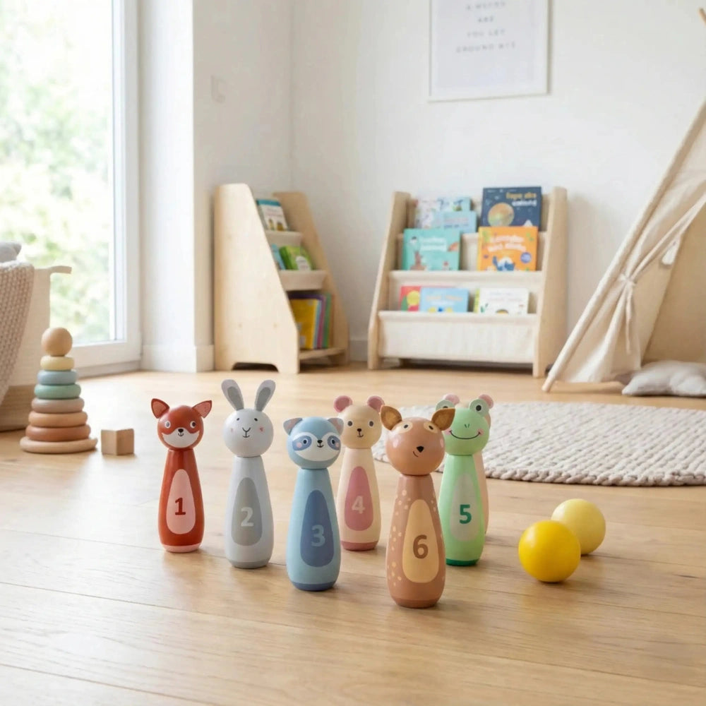New Classic Toys bowling set features six multi-colored wooden animal toys and a yellow ball on a light brown wooden floor.
