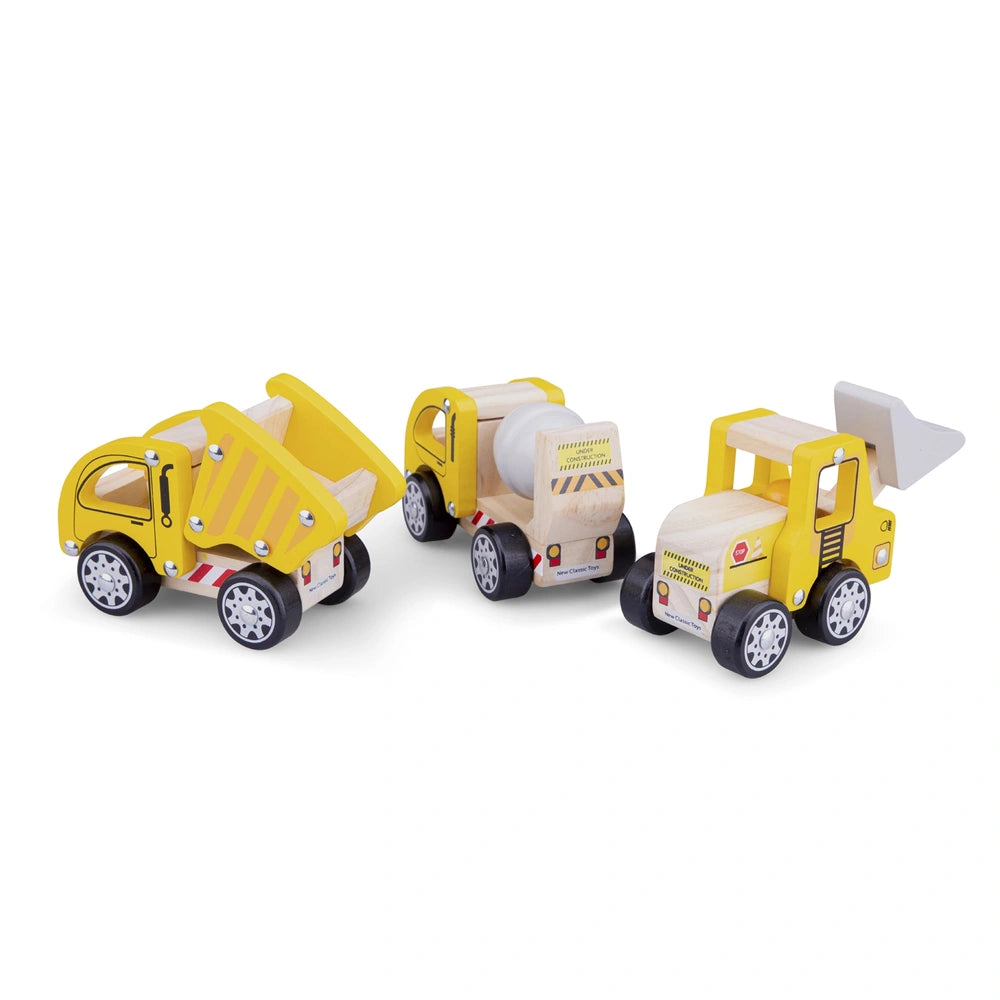 New Classic Toys construction vehicles set featuring three wooden toy trucks with yellow, white, and red accents, and black w