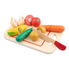 New Classic Toys cutting set featuring a wooden board, plastic knife, and colorful toy vegetables including corn, tomato, gar