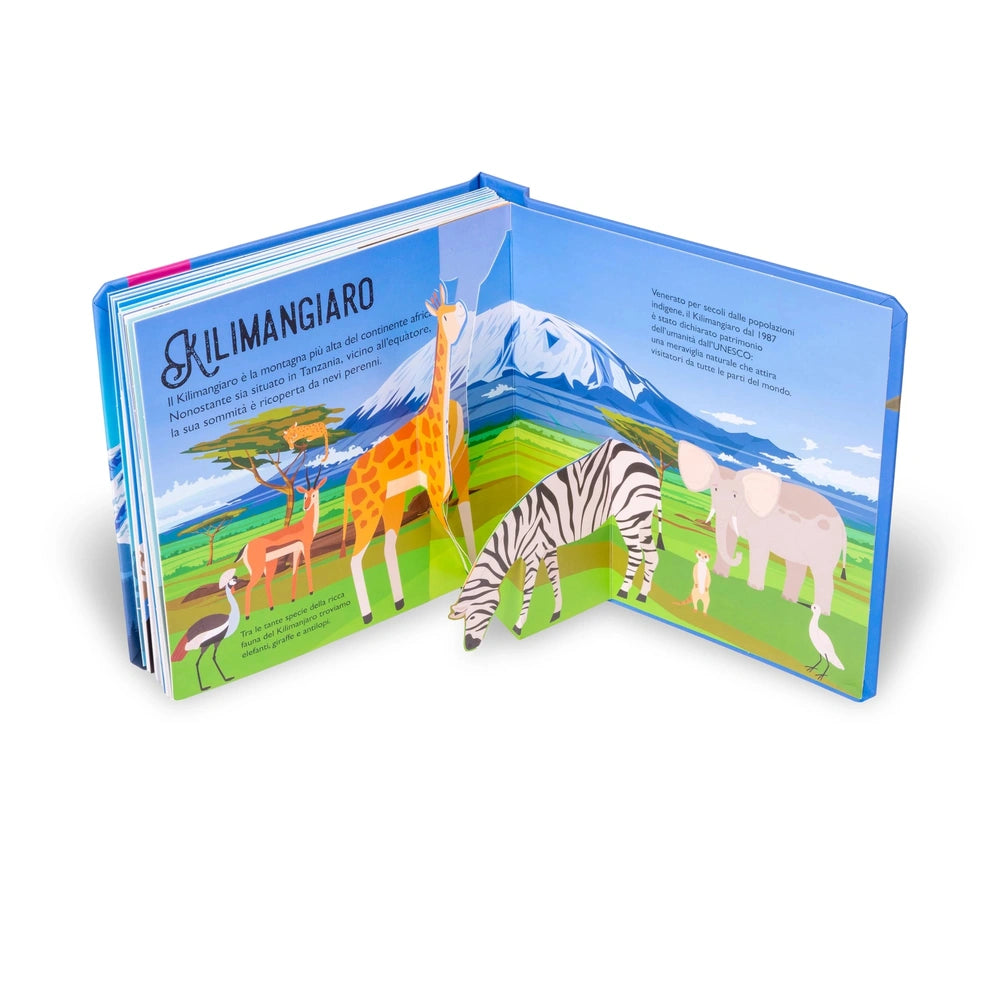 NUINUI Montagna Sorprendenti Pop Up book features a giraffe, zebra, and elephant against a blue background with mountain illu