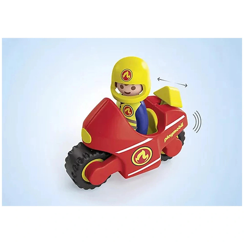 Playmobil motorcycle toy set features a red plastic bike with yellow helmet, black seat, and flame decals on wheels and body.