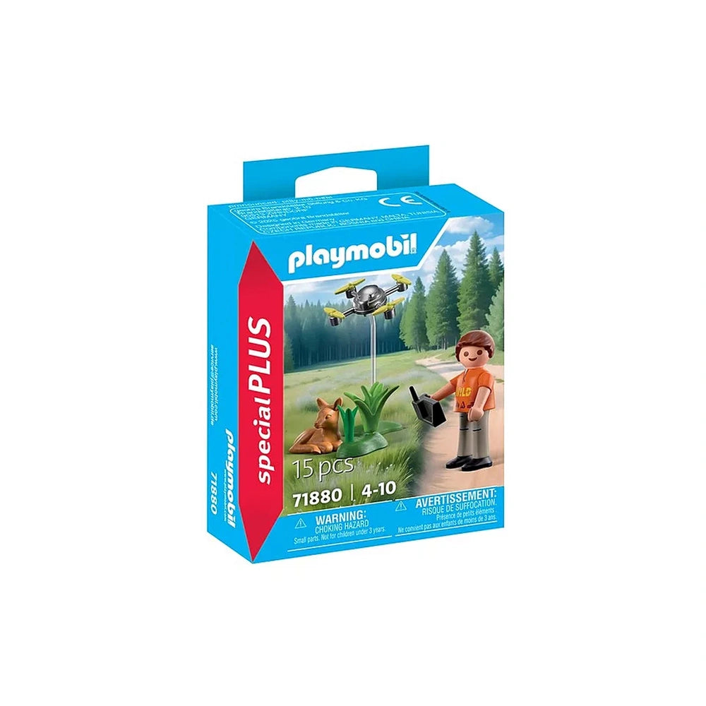 Playmobil Fawn Rescue with Drone toy playset features a figure in orange shirt and gray pants on a green base within blue pac
