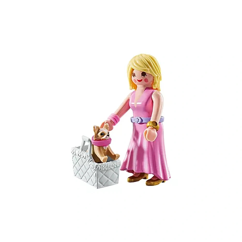 Playmobil It-Girl toy playset features a blonde doll in a pink dress holding a white basket with a diamond pattern.