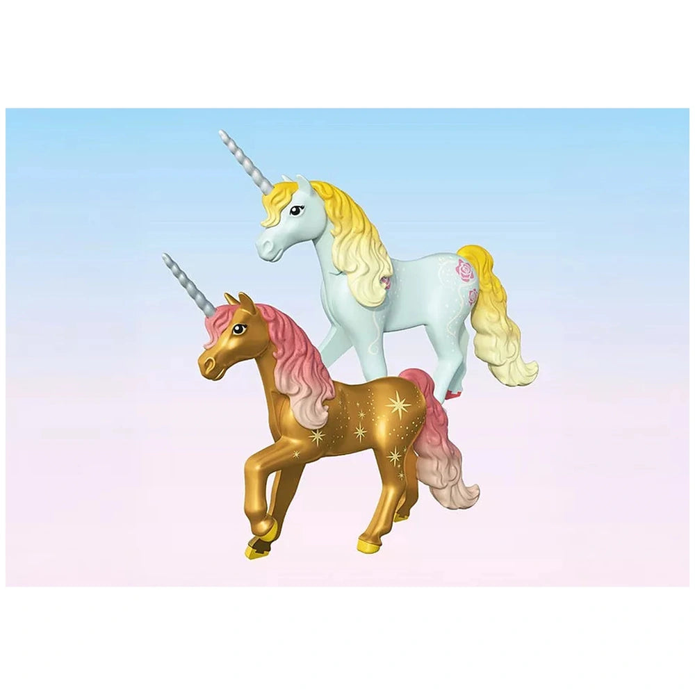 Playmobil Magic Unicorns Cozy Fairy Home features two glossy unicorn figures with golden, pink, and yellow manes on a light b