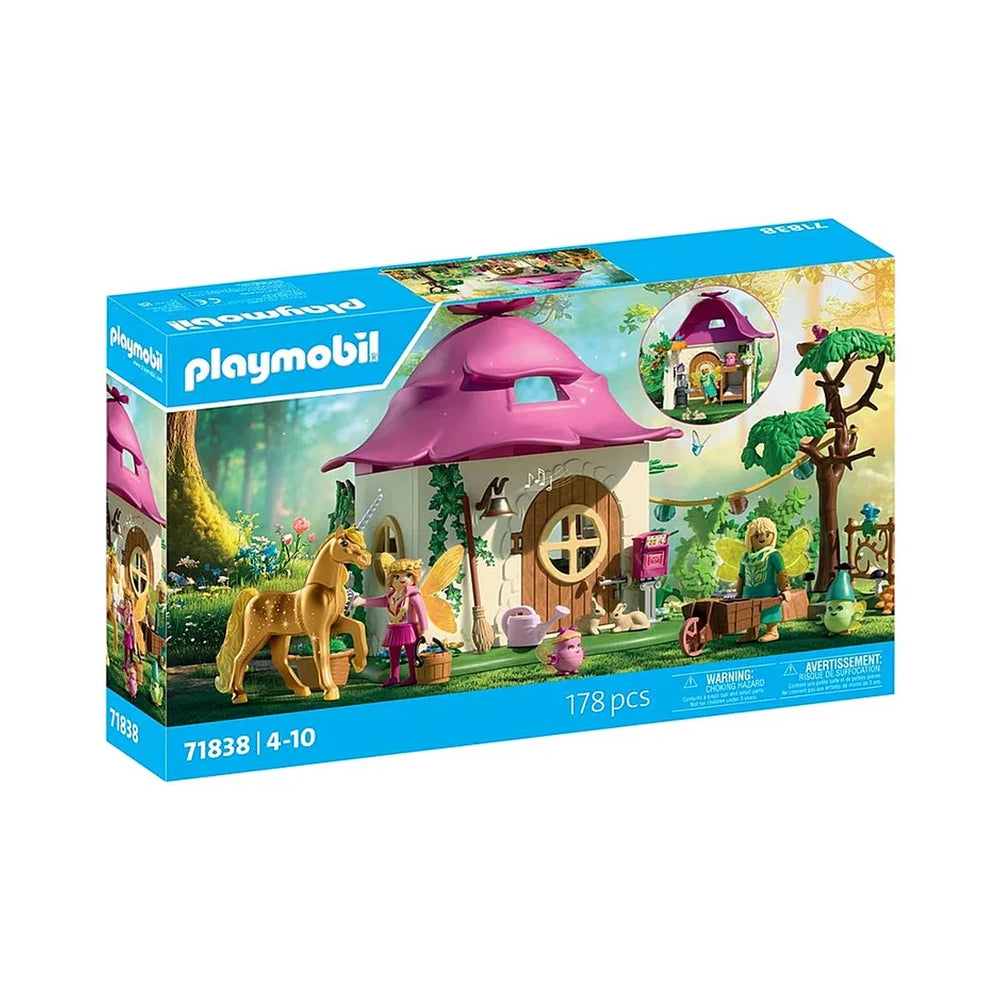 Playmobil Magic Unicorns Cozy Fairy Home toy set featuring a pink house, yellow horse, girl in pink dress, and colorful acces