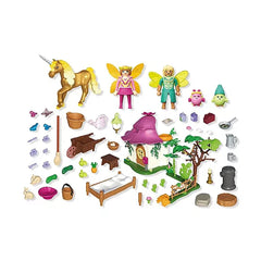 Playmobil Magic Unicorns Cozy Fairy Home set features plastic toys, wooden bed frame, and glass elements in a vibrant scene.