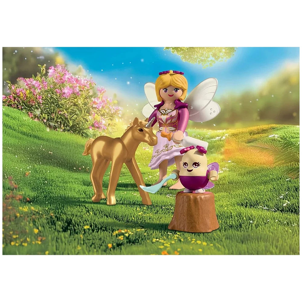 Playmobil Magic Unicorns playset featuring a shiny gold horse, a glossy fairy, a brown mushroom, and pink flowers on green gr