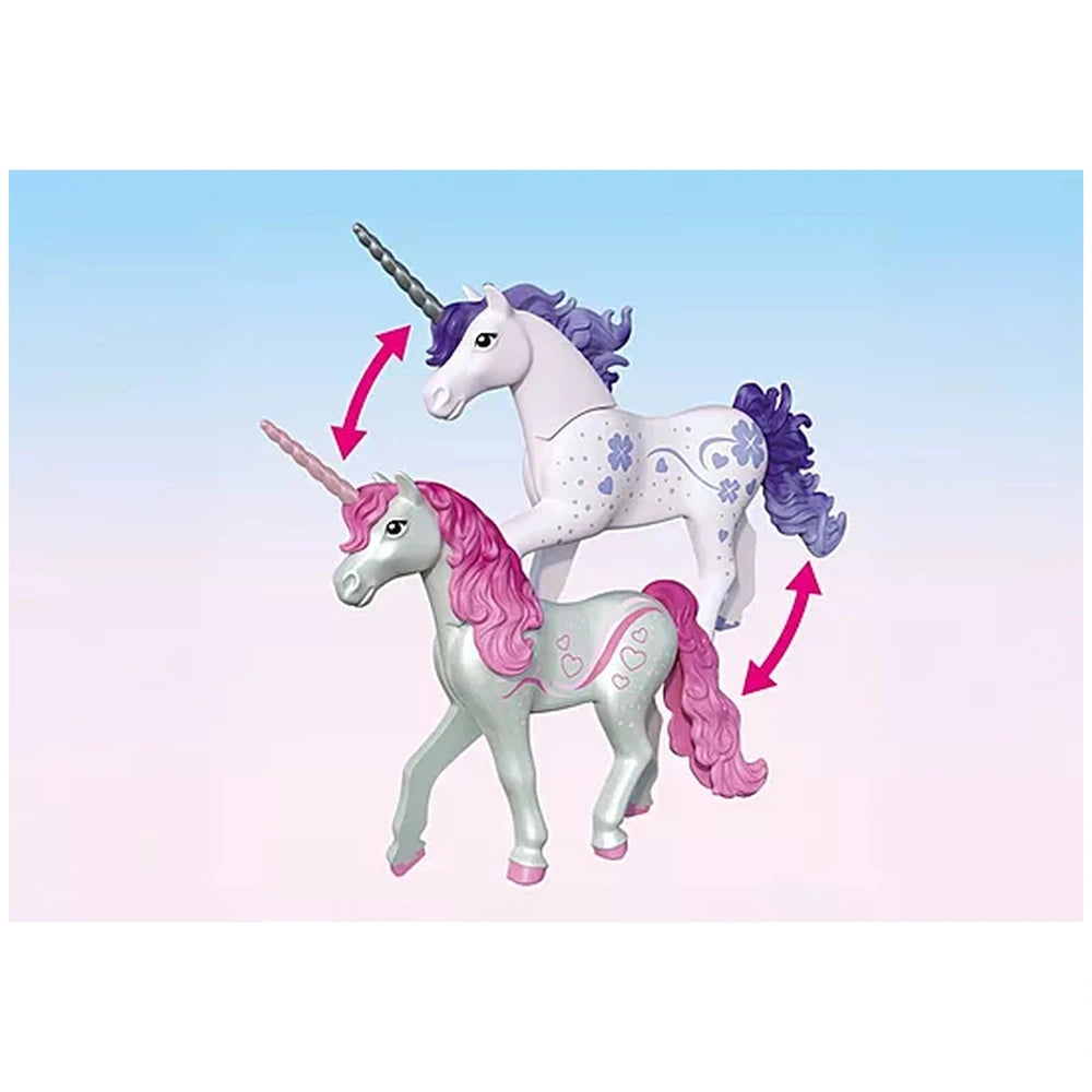 Playmobil Magical Unicorn Stable features two glossy plastic unicorns, one with a pink mane and the other with a purple mane.