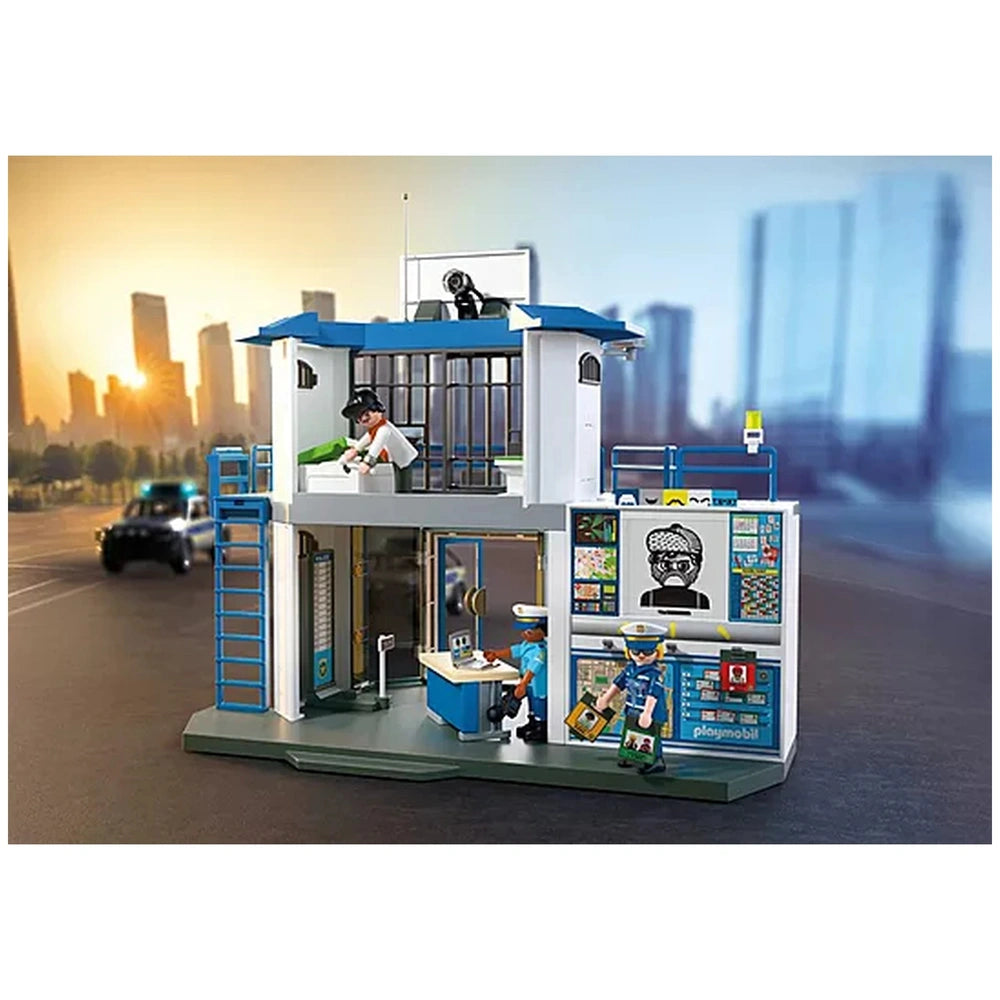 Playmobil Police Station toy playset features a blue roof, white walls, and dark grey door with blue metal railings and stair