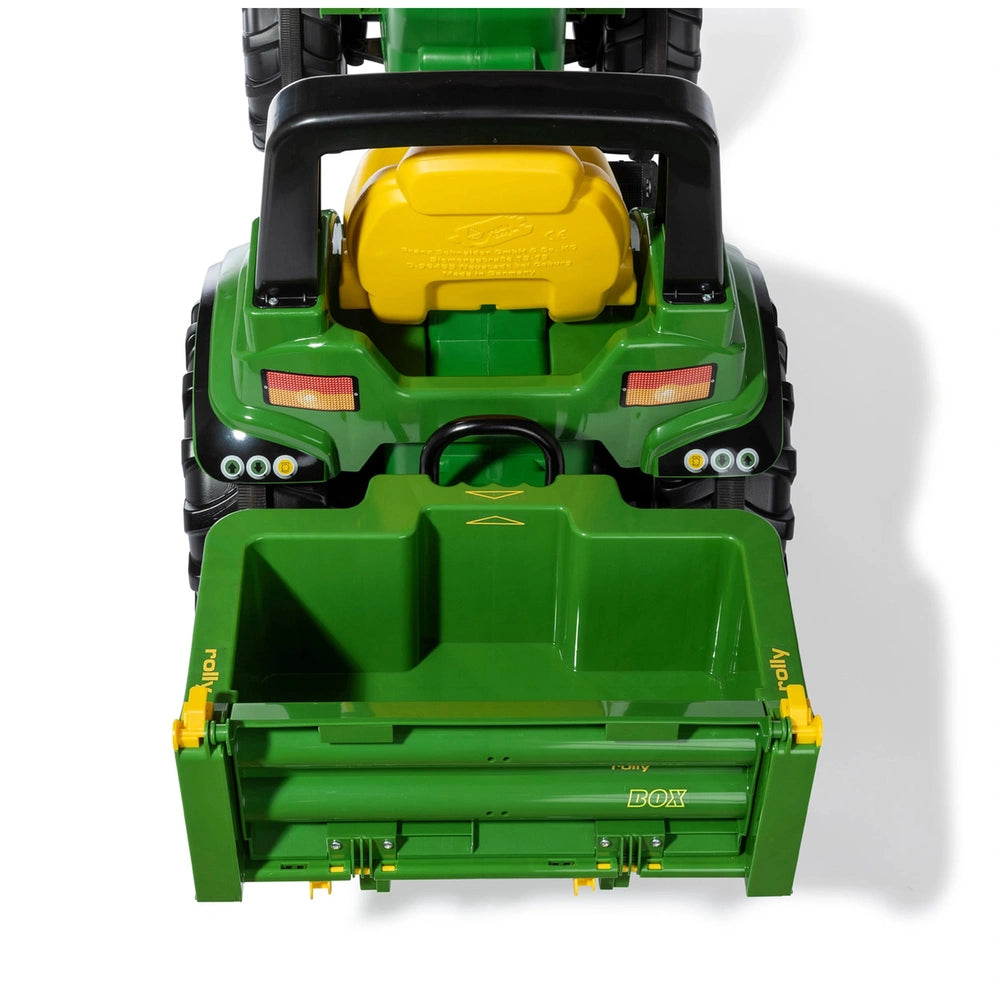 Rolly Toys Rollybox John Deere green toy tractor features a yellow seat, black roof, and orange headlights in a front view la