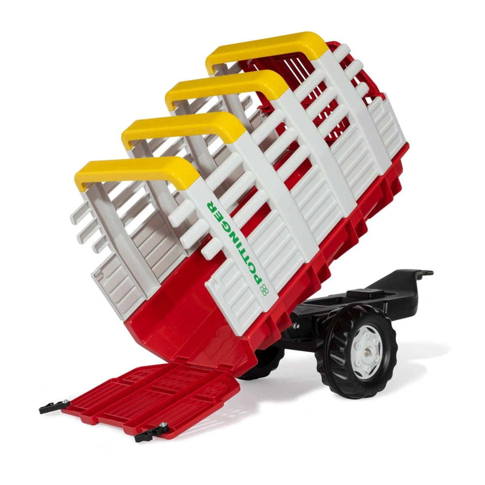 Rollyhay Wagon Pottinger Trailer features a red and yellow toy tractor with a raised trailer on a flat surface.