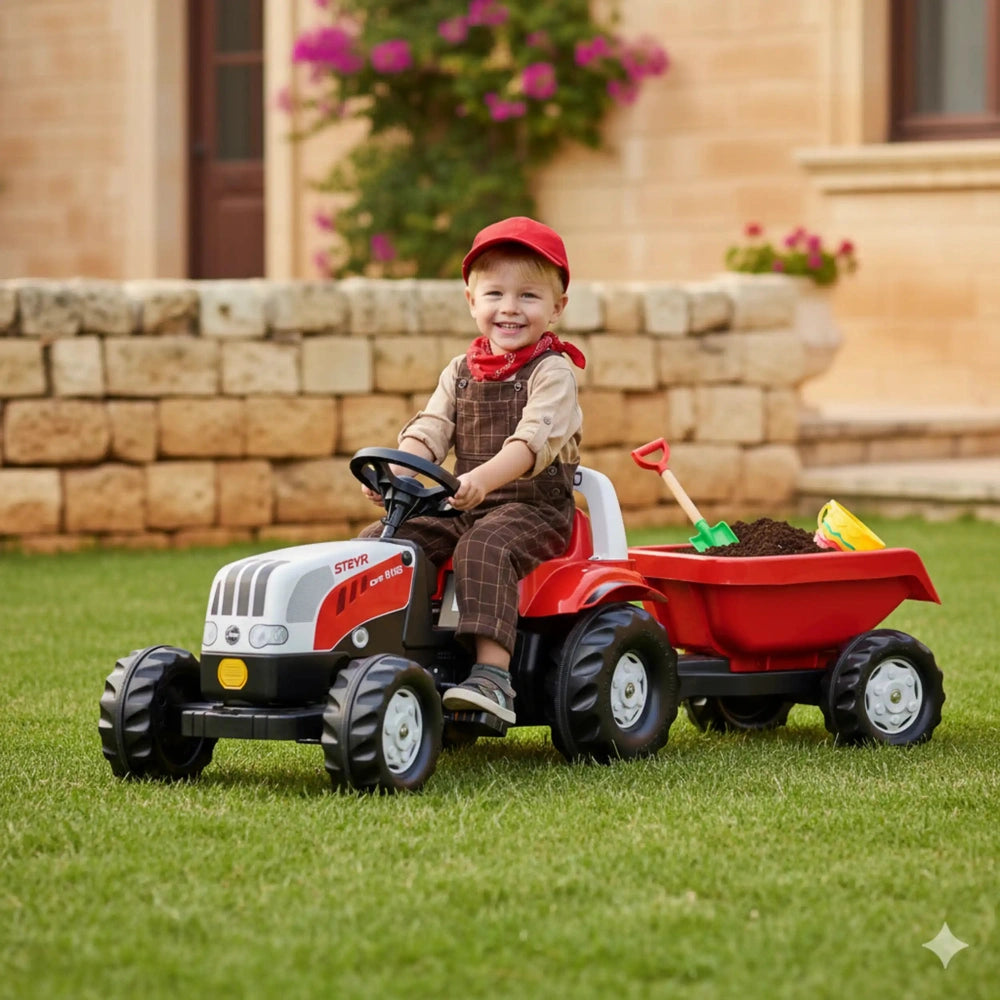 Rollykid Steyr 6165 Cvt tractor with trailer, red, with a smiling child in a brown jumpsuit and red cap, enjoying outdoor pla
