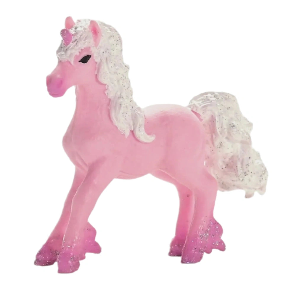 Bright pink toy unicorn foal with white accents and glittery hooves, standing upright against a plain white background.