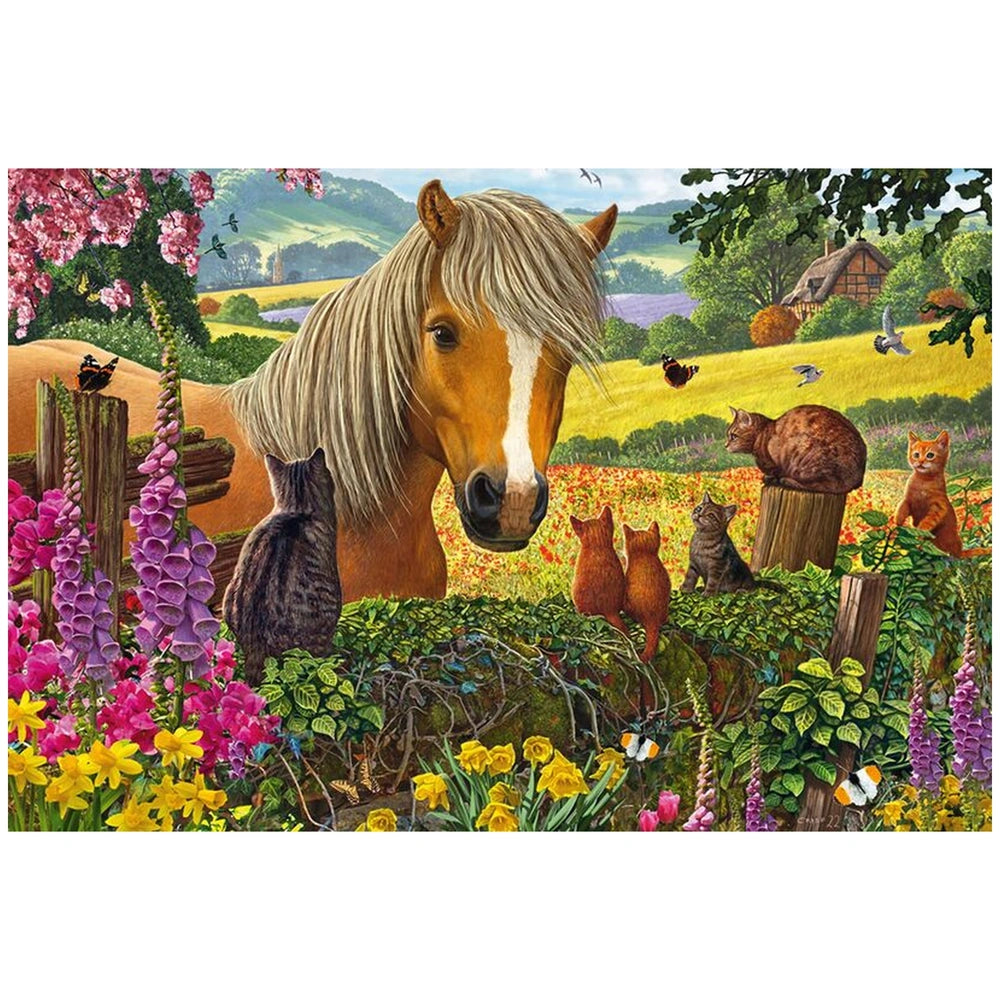 A horse with a blonde mane stands peacefully in a vibrant field alongside several colorful cats and a distant house.