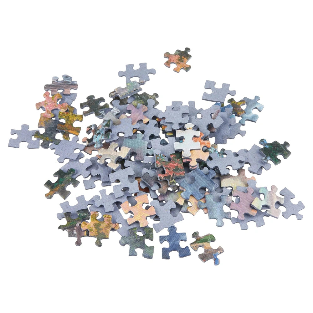 Schmidt Spiele Bambi 1000-piece puzzle pieces scattered in various colors and shapes on a plain background.
