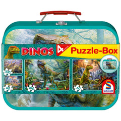 Schmidt Spiele Dinos puzzle box features colorful dinosaur designs, 100 white puzzle pieces, and a glossy green cardboard cas