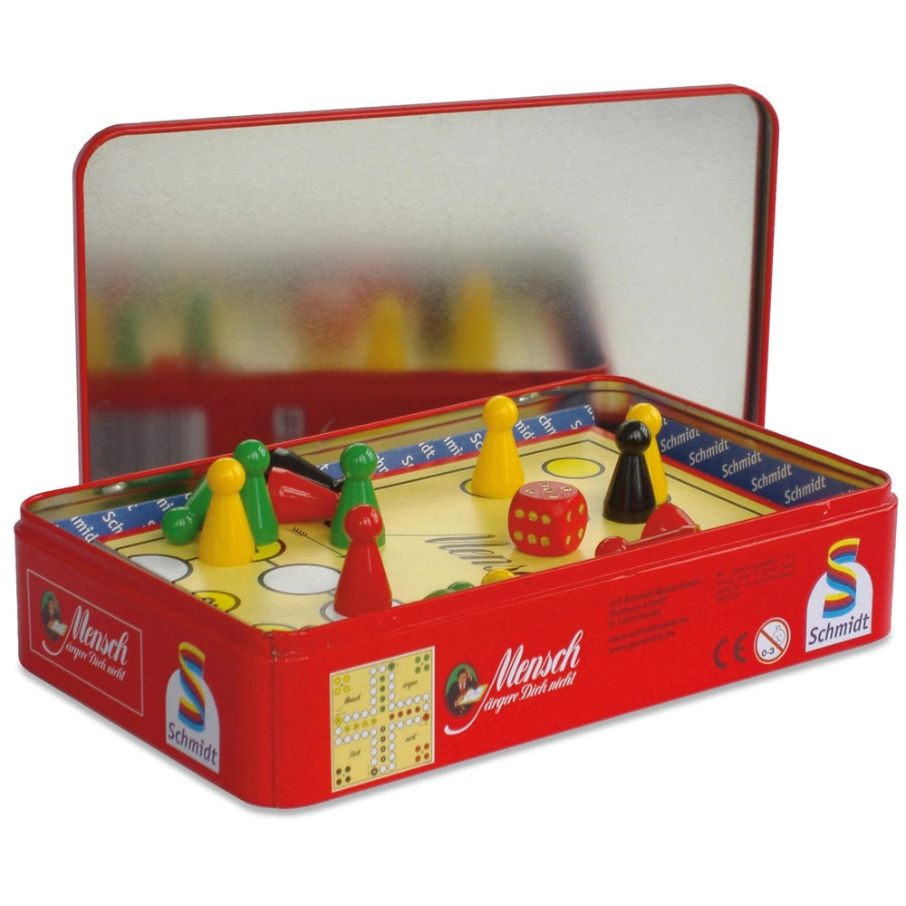 Schmidt Spiele's Don't Bother Me game features a red toy box, a grid-patterned board, and colorful game pieces.