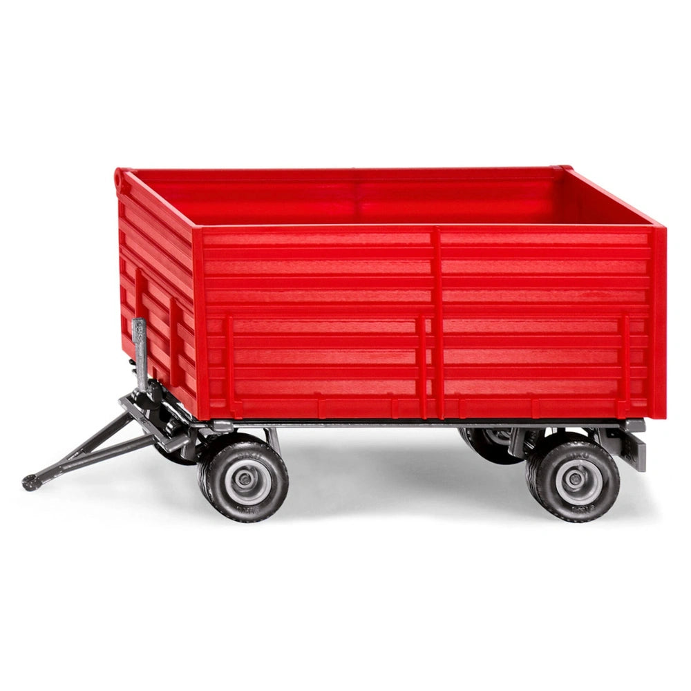 Red toy wagon with a flatbed and four black rubber wheels, designed for children's play against a light background.