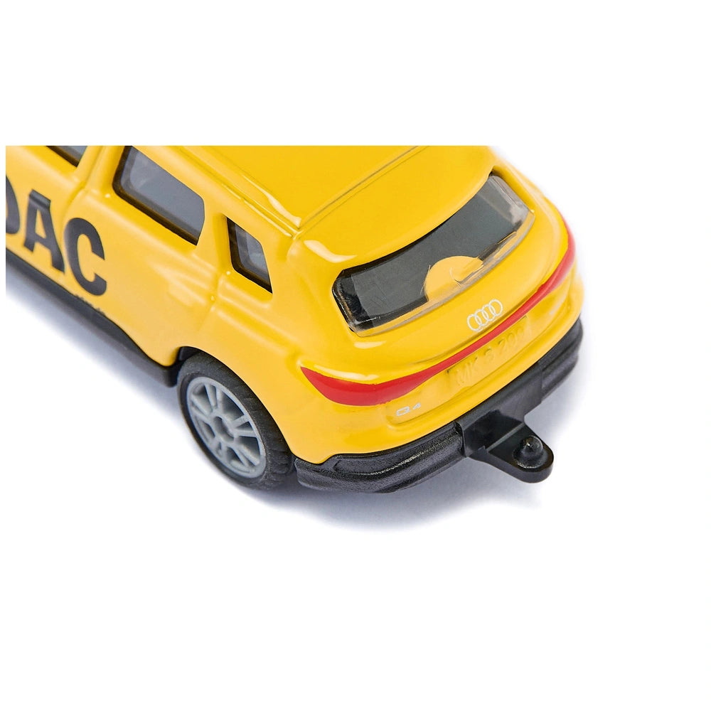 Yellow toy Audi Q4 e-tron breakdown service vehicle with glossy finish, black wheels, and "AUD" branding on the side.