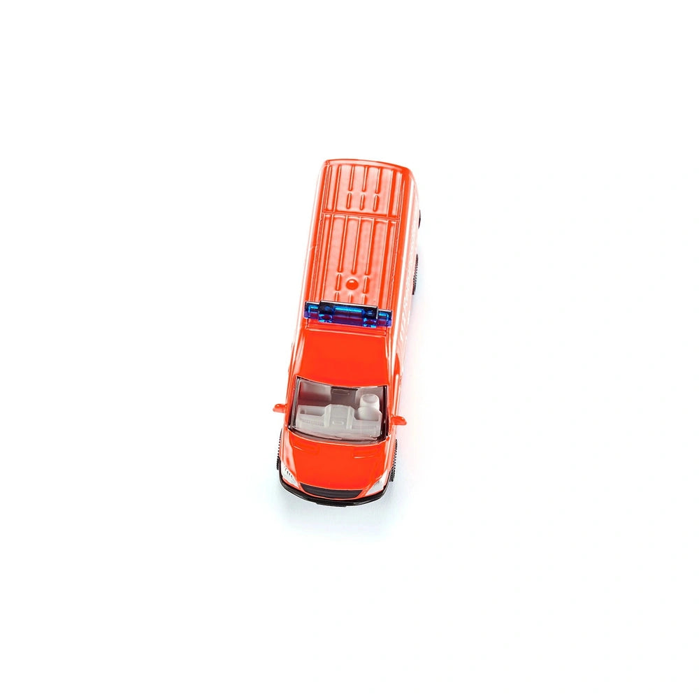 Bright orange toy ambulance with a glossy finish, featuring a front grille, headlights, and a simplistic design against a whi