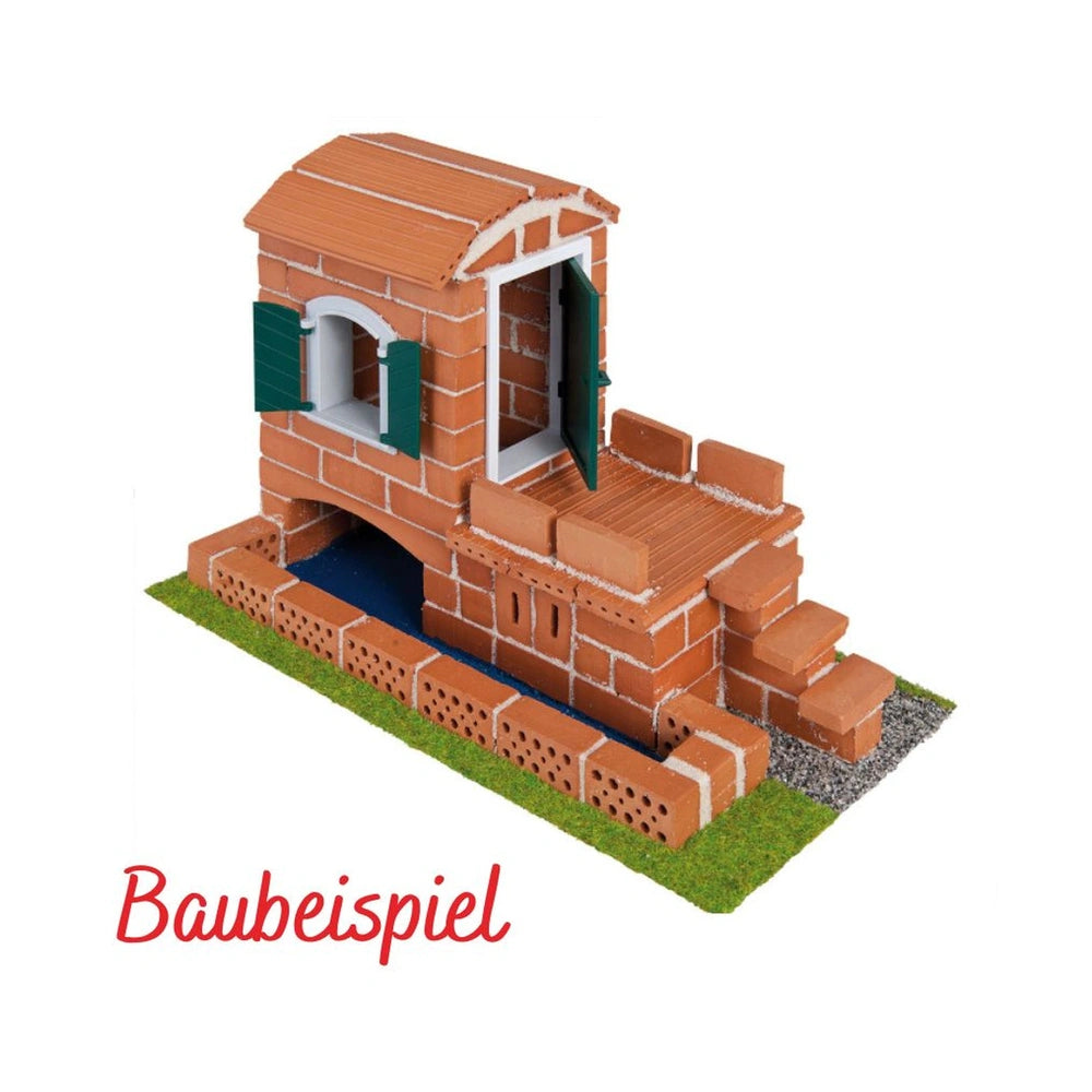 Teifoc creative box features a model brick building with a chimney on a green base, showcasing arts and crafts potential.