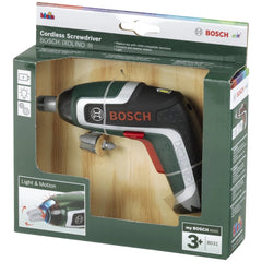 Theo Klein cordless screwdriver toy in green and white packaging, featuring a plastic window and printed child-friendly funct