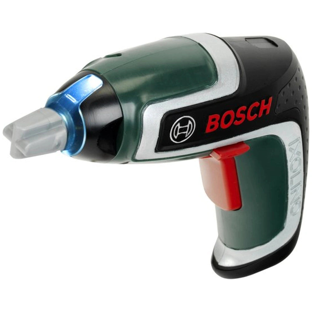 Theo Klein cordless screwdriver in green plastic with red trigger, gray nozzle, and black grip, featuring "BOSCH" branding.