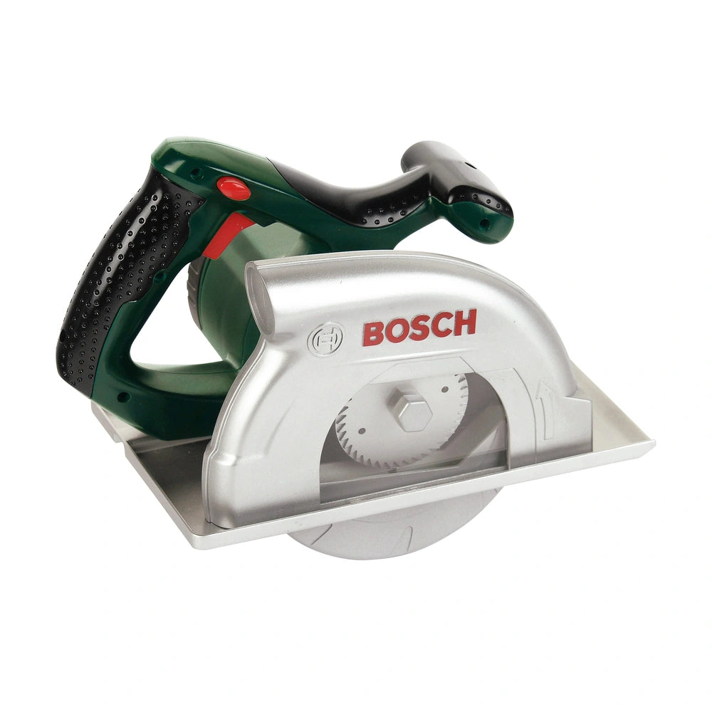 Theo Klein Bosch circular saw with green handle, silver body, black grip, and red button, placed on a white surface.