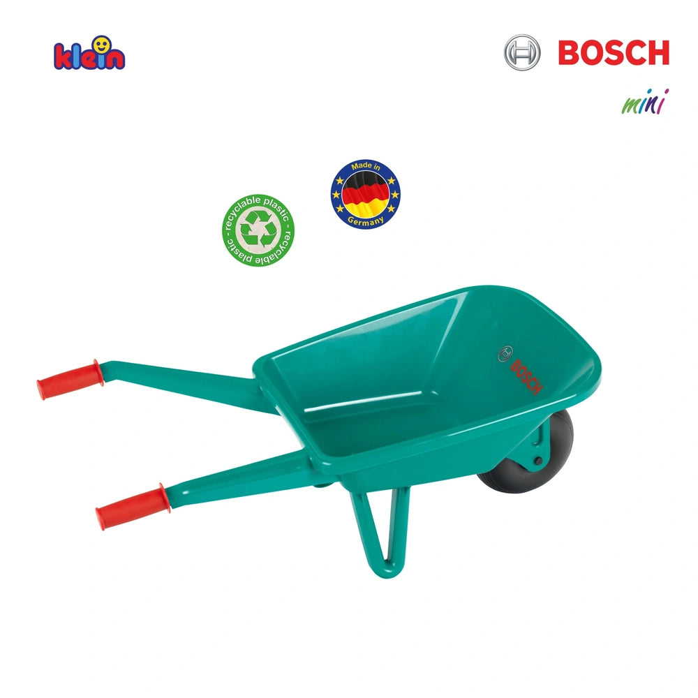 Theo Klein Bosch garden wheelbarrow in green plastic with red handles, black wheel, and white base for outdoor play.