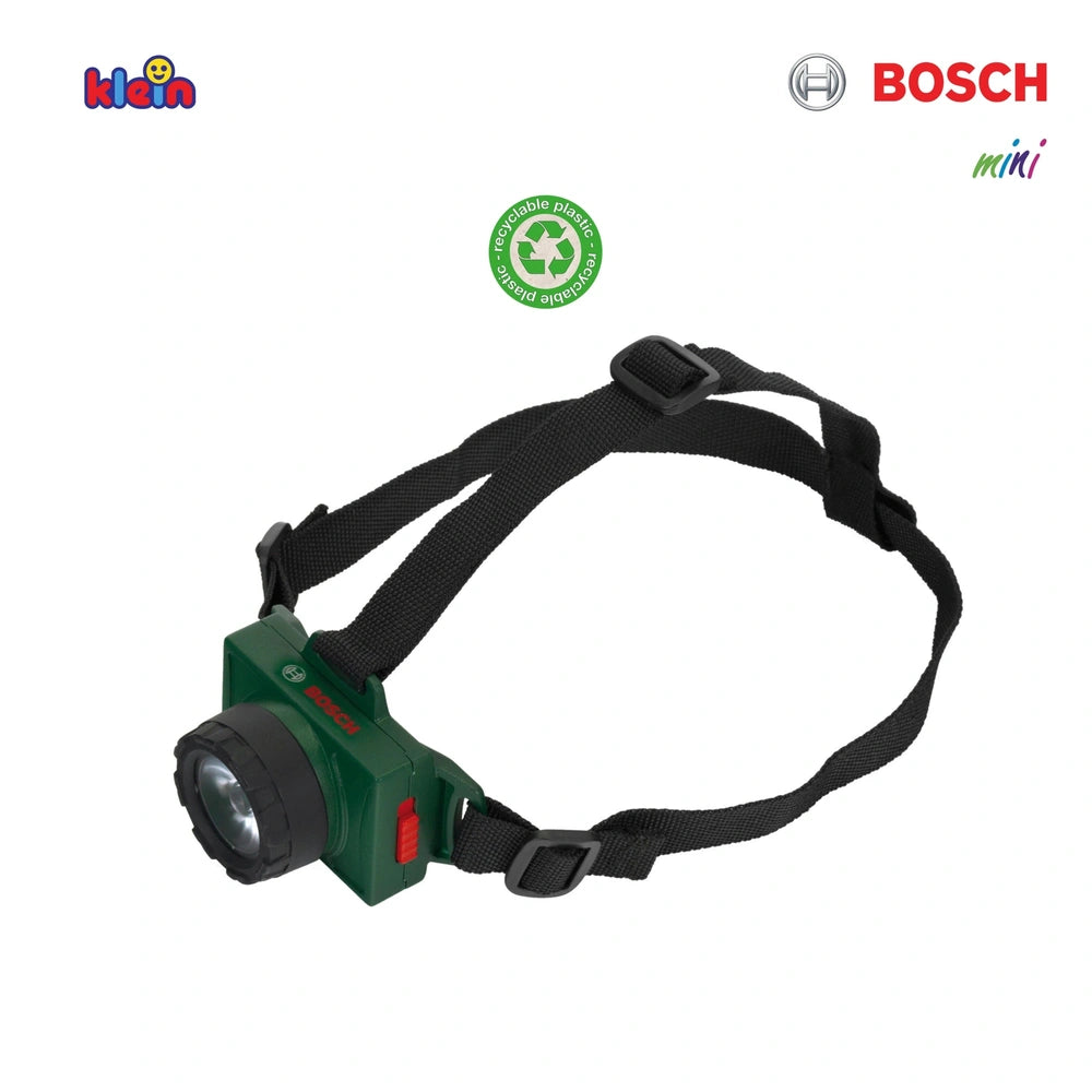 Theo Klein Bosch head lamp featuring a green body, black strap, and lens with white and red branding logos.