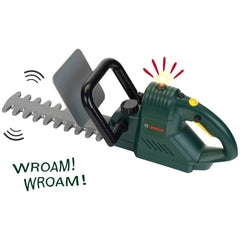 Theo Klein Bosch hedge trimmer features a green plastic body, silver metal blade, black handle, and "WROAM!" text.