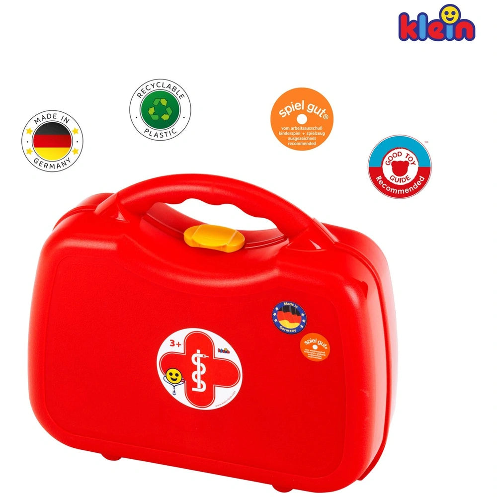 Theo Klein Doctor Case in red glossy plastic with yellow lid, featuring printed stickers and a handle for pretend play.