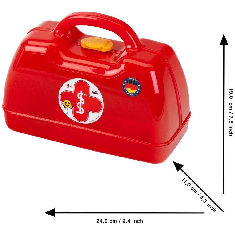Theo Klein Doctor Case in red glossy plastic with yellow lid, red cross sticker, and smiley face, featuring a front window.